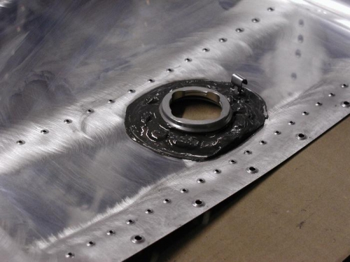 The inside of the fuel cap flange.