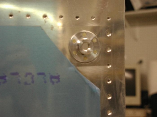 Outside of tank drain.