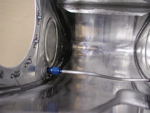 The vent line is attached to fitting in the inboard rib. The rib is also sealed in place.