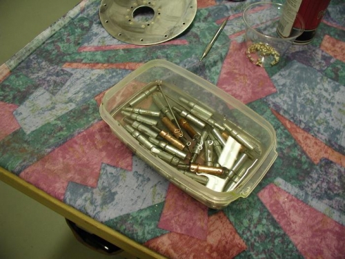 Cleaning the tank sealant from the clecos.