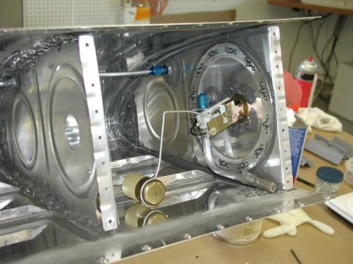 Made adjustments to float arm before installing baffle.