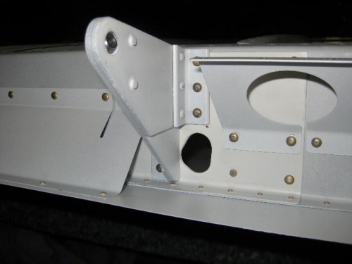 This pic shows the aileron gap brace, flap brace, and inboard aileron bracket -with all riveting done.