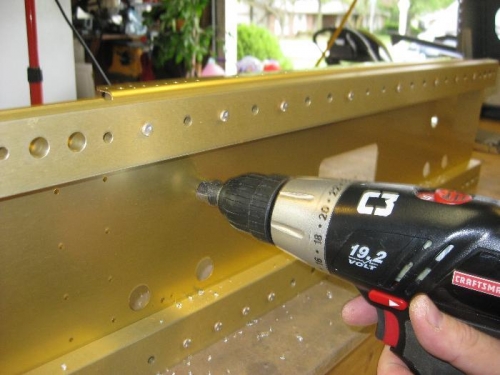 Enlarging the holes for rudder cable passthroughs