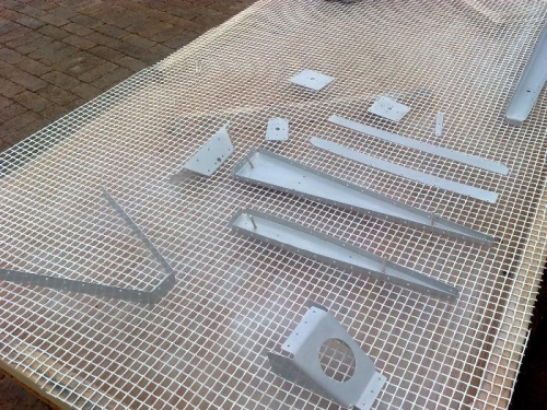 Rudder parts lying on the spray table waiting to dry