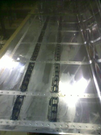 Stiffeners rivetted in place with shop-heads encapsulated with proseal