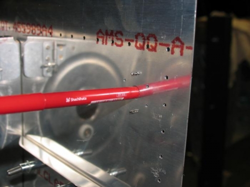 Red koki pen used to line up the fuel drain mount
