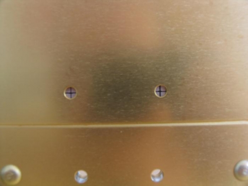 Spacer markings visible through pilot holes in spar web