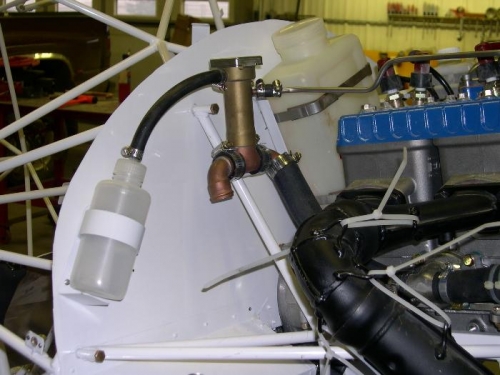 Relocation of radiator overflow Bottle