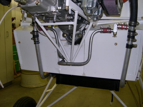 Fire wall side of heater hose installation