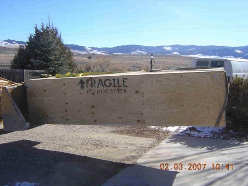 Crate on backhoe bucket