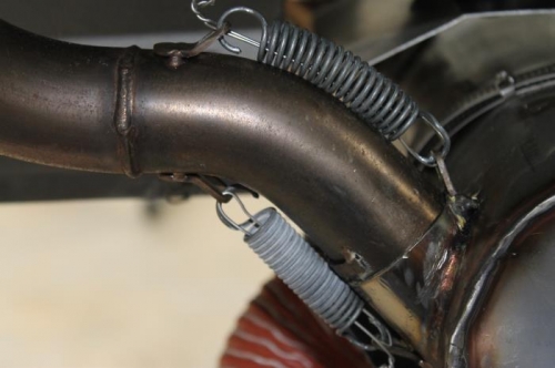 Safety wire inside exhaust spring