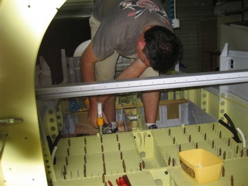 Riveting rear seat bases