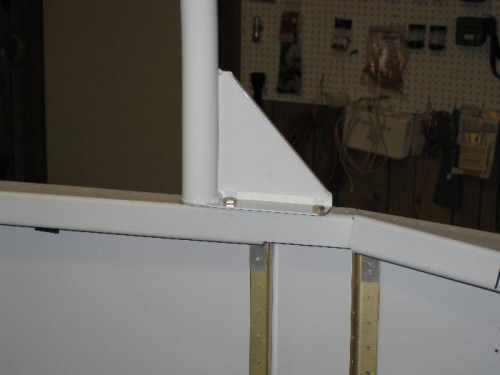 The roll bar flange bolted to the aft canopy deck.