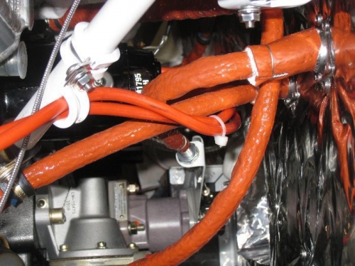 Mixture & prop cables, fuel pressure hose, and ignition wires.