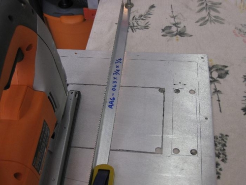 The straight edge clamped to the panel plate.