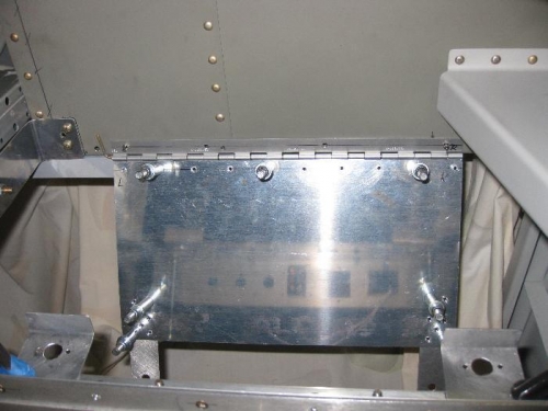 Panel clecoed in the dropped position with attach brackets showing on instrument panel frame.