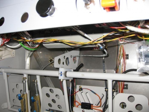 The cabin heat cable through the panel, the supanel connect, then through the rudder pedal support.