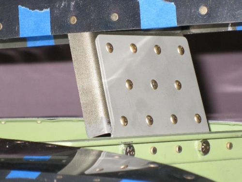 Close-up of attach plate riveted to spar.