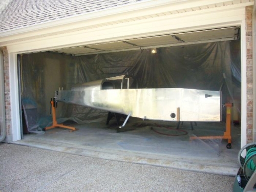 Hung plastic sheeting from garaged door structure.