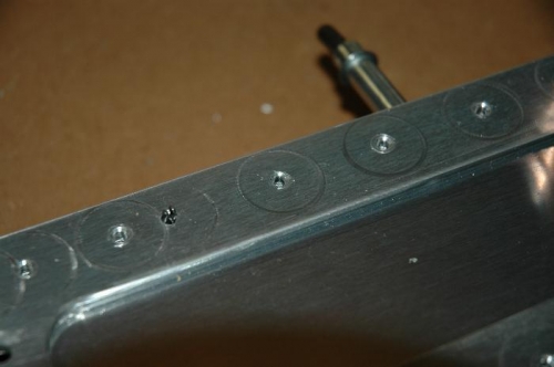 Here's a closeup of the countersunk holes.  The rings around the hole are from the countersink tool.