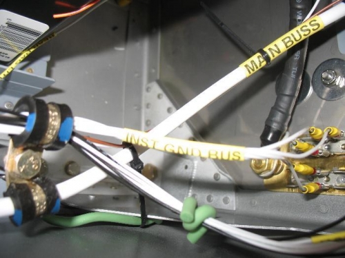 Five wire bundle attached to the ground tabs at the firewall