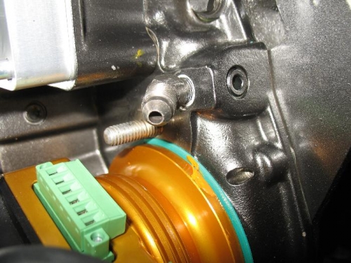 Restrictor fitting which sends oil to the pressure sensor.