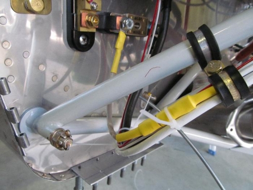 The yellow covers a butt splice for the fuseable link for the standby alternator.