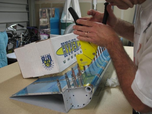 Rivet bottom skins to spar.