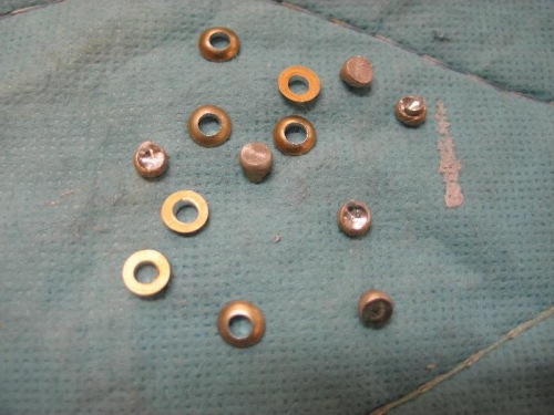 Drilled out rivets.