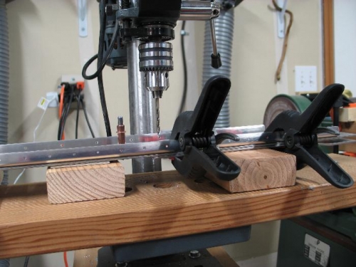 Level on drill press table.