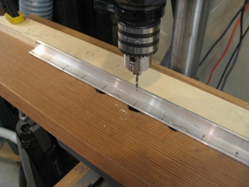 Drill press fence helps in hole locations.