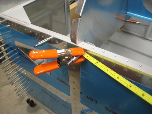 Tape clamped on fuselage.