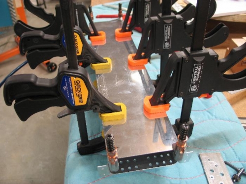 Clamp and drill cover.