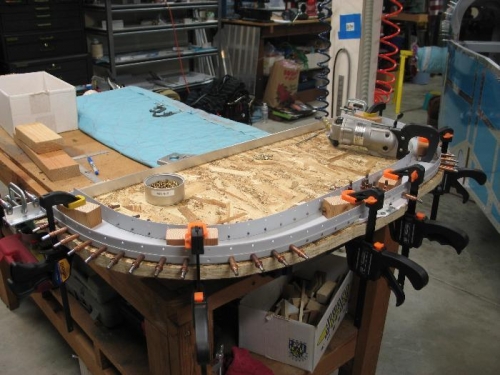 Clamped for riveting.