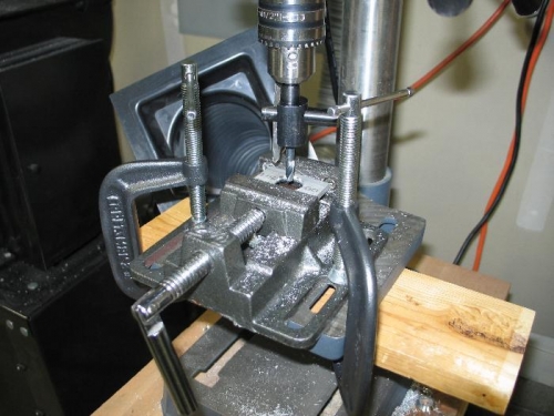 Hole cutter in drill press.