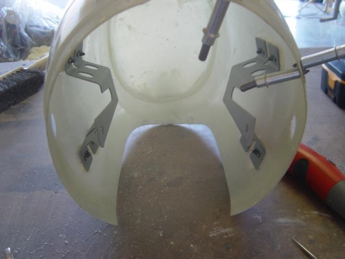 Nose gear attach brackets attached to fairing