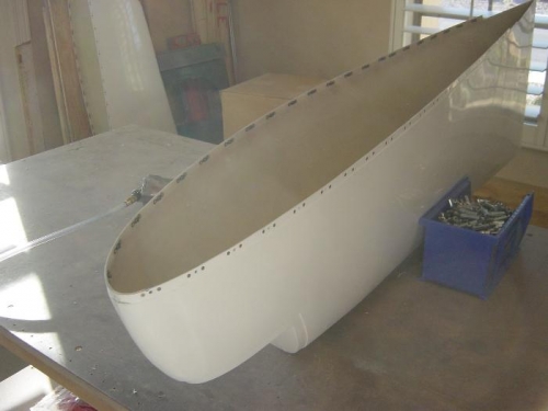 Riveting the nutplates to wing tip