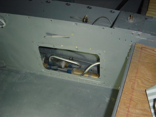 Fuel access panel doubler riveted in place