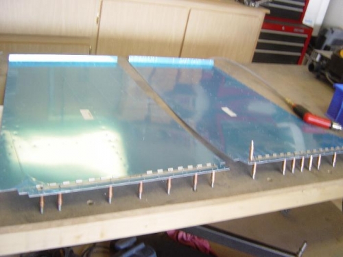 Cut, drilled, and clecoed the hinges for the seat back supports to the baggage floor