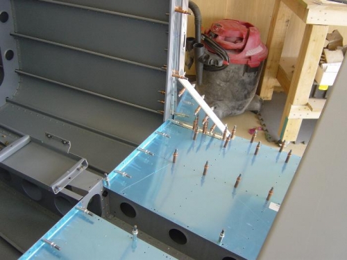 Baggare area door frame clecoed, & drilled