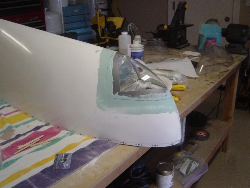 Lens' being 'faired' for exact fit.