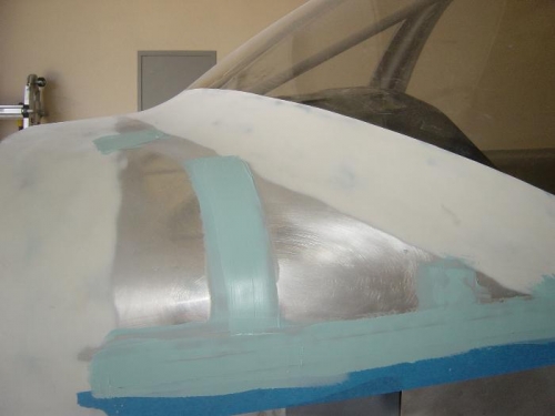 Filling and sanding remaining rivets 7 lines in the upper fwd fuse - BEFORE