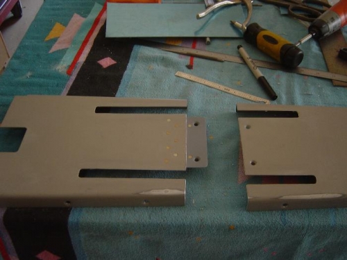 Slots cut for amrs, and tunnel cover sectioned for installation and remove around arms