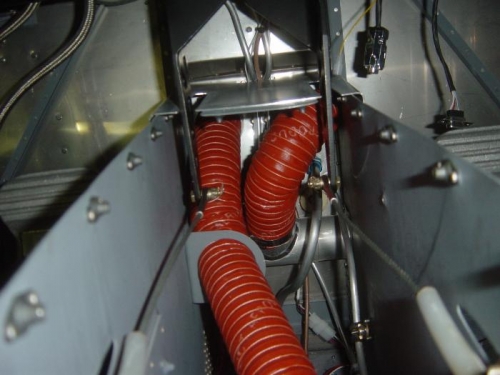 Scat tubes secured to eliminate interferrence with rudder cables and arms