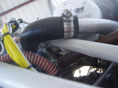 Clamp on breather tube rubs on engine mount