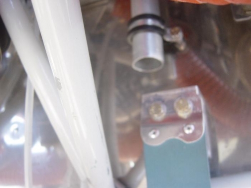 bottom of breather too close to exhaust hanger bracket