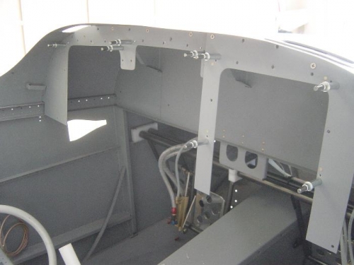 Installing nutplates to the attach support bracket for the upper holes