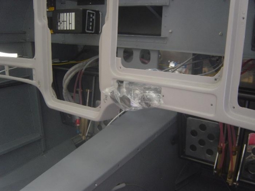 Cabin heat and parking brake control cables positioned for firewall distance