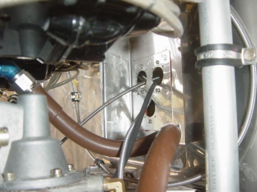 Engine control cables eyeball fixture riveted in place.