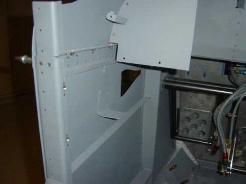Left side panel attach support riveted in place.
